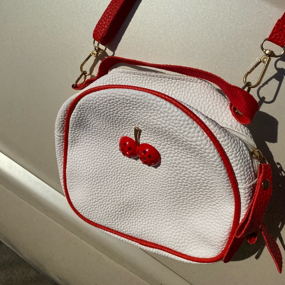 White cherry purse with matching earrings.